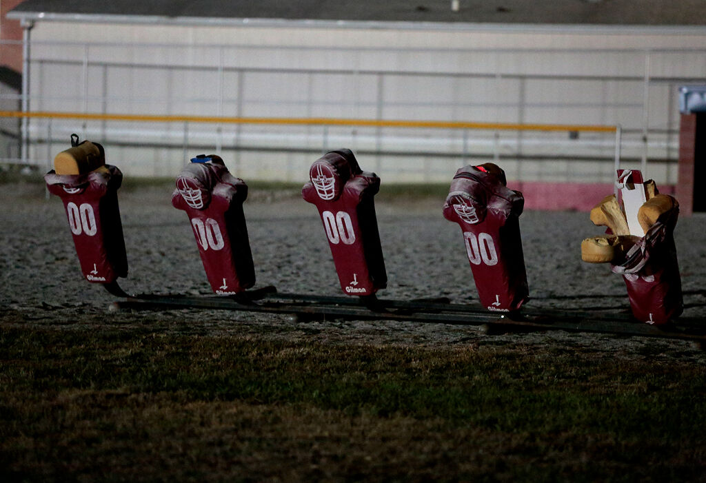 Football tackle dummies sit in a line just off of the Appleton City High School football field on Friday, Oct. 2 in Appleton, Mo.